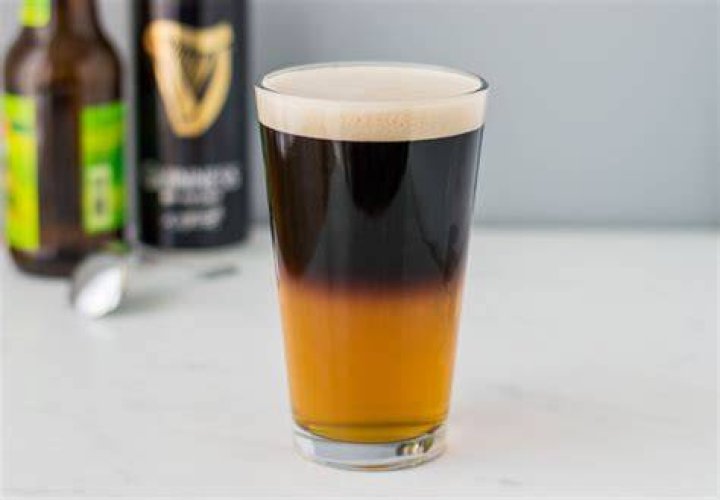 Black and ___ (colorful name for a mixed drink containing ale and stout)