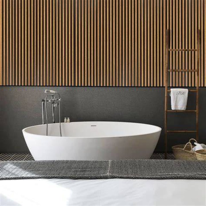 Cylindrical item on a bathroom wall