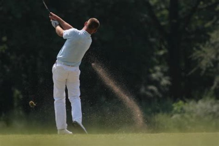 Why do pro golfers always take a divot?